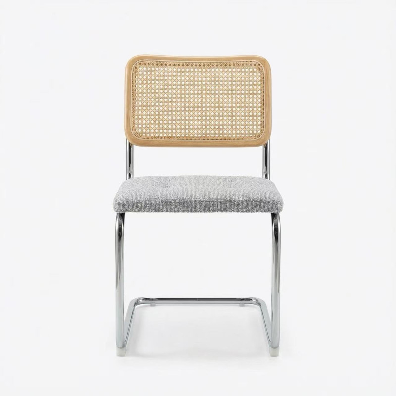 Ambiance salle à manger villa moderne – chaises cannage et table design haut de gamme